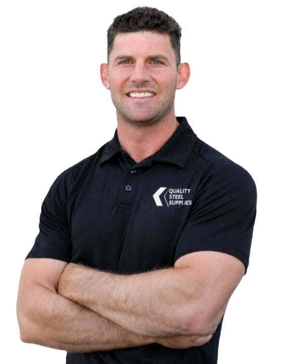 Smiling man with short dark hair wearing a black polo shirt bearing the Quality Steel Supplies logo, arms crossed, against a white background.